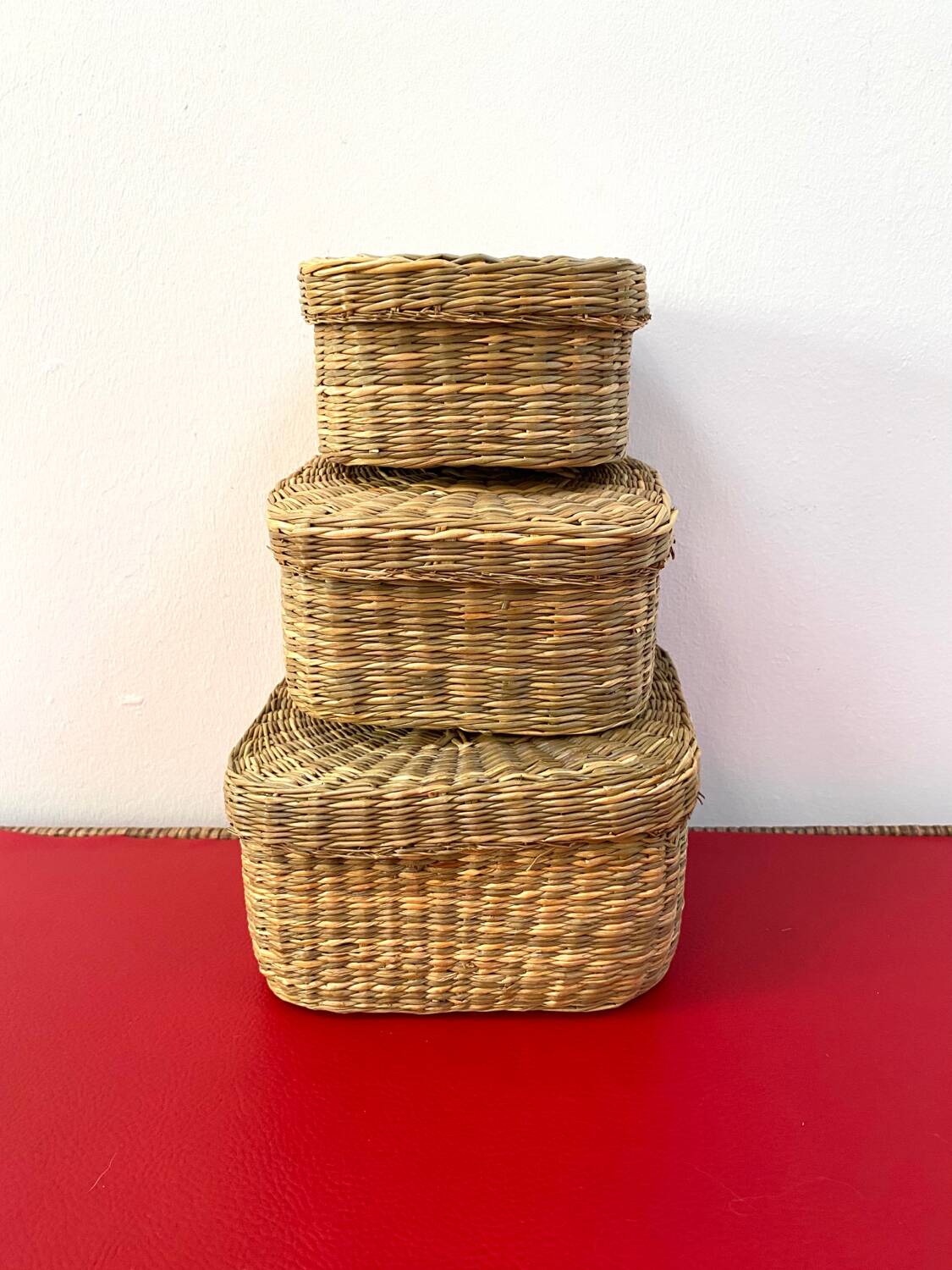 Vintage trio of small rattan nesting baskets