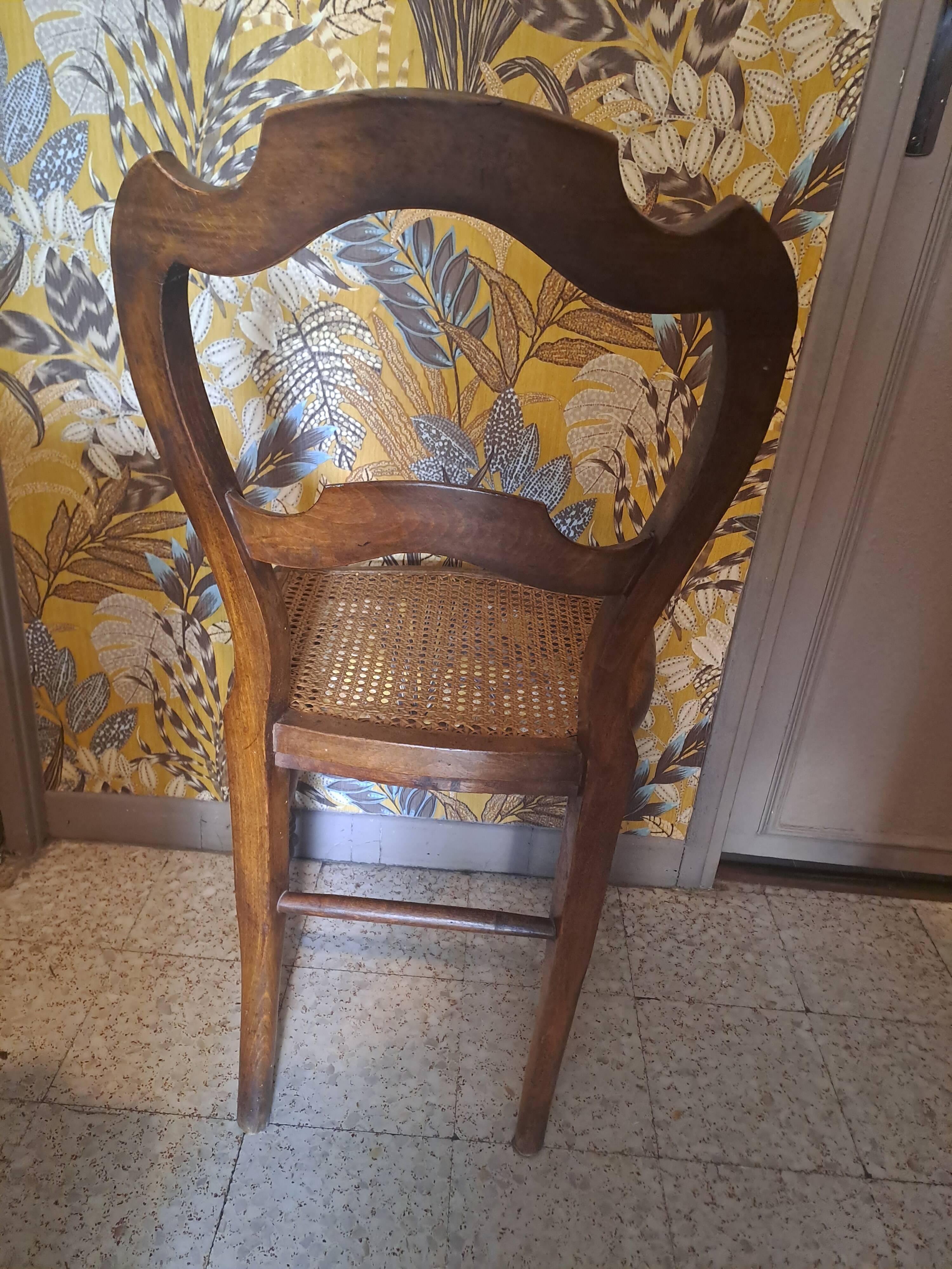 Pair of 1950s light wood bistro chairs with cane seats