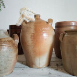 Ancient jar in varnished sandstone