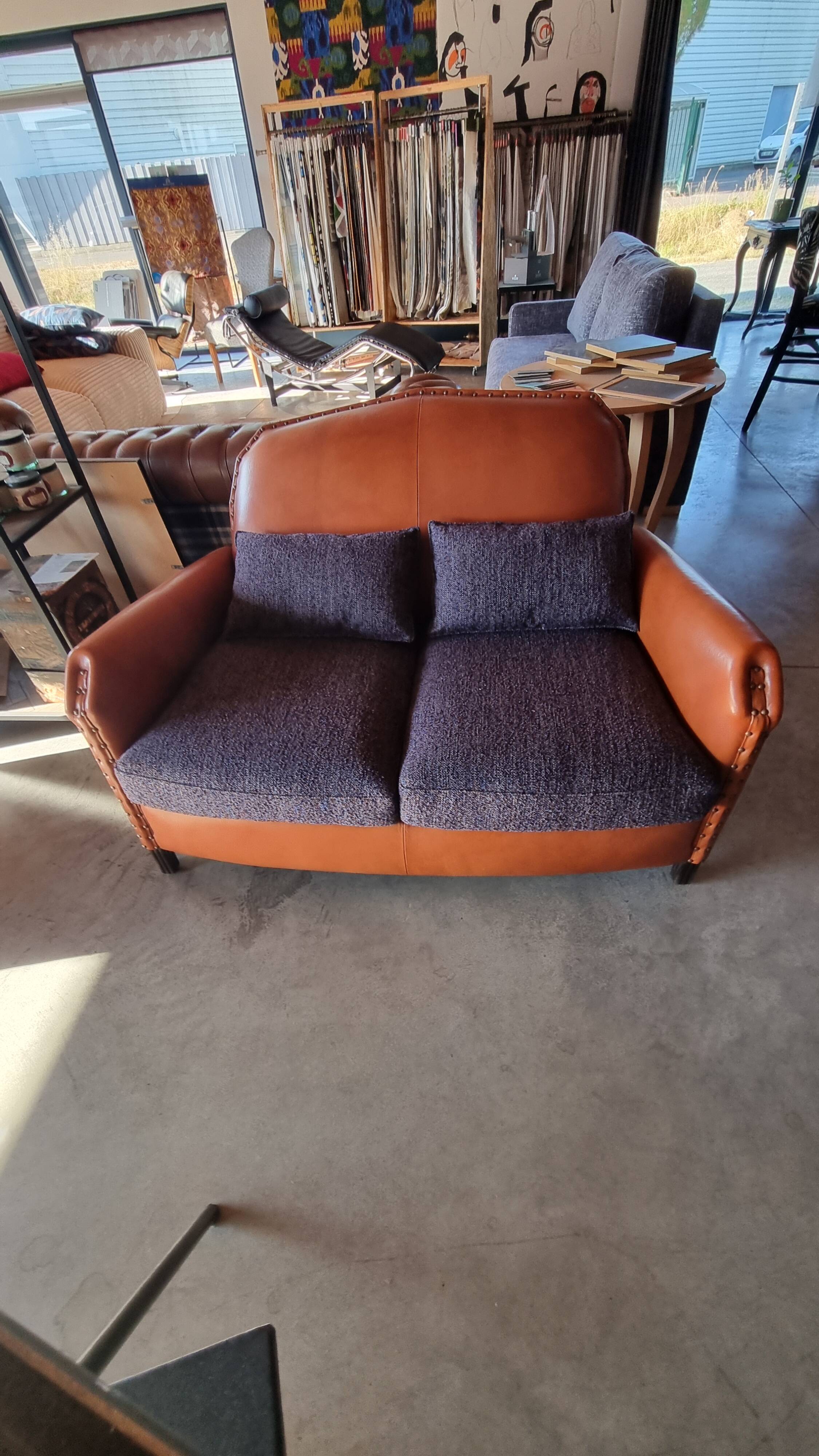 Club sofa in leather and fabric