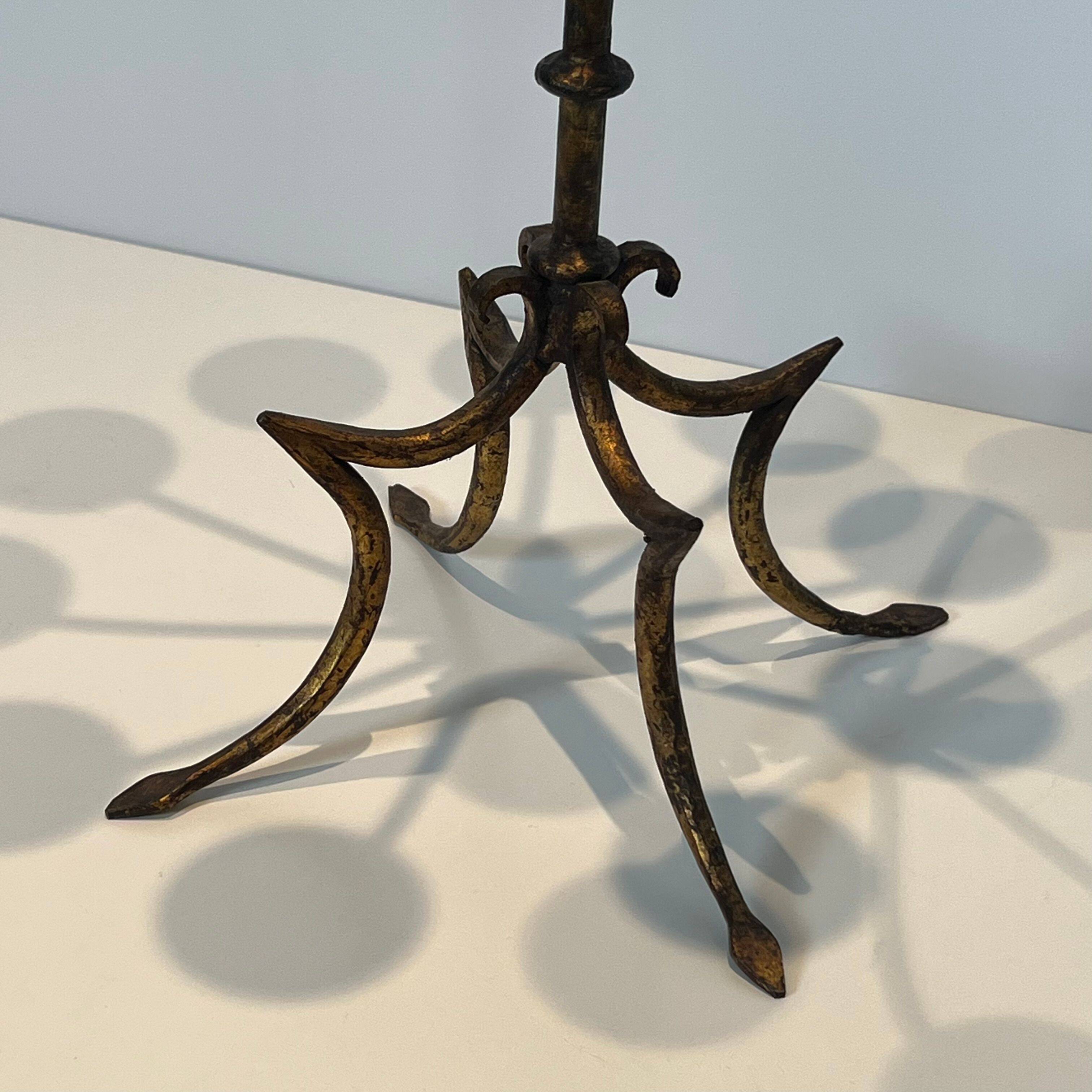 Important gilded wrought iron candelabrum with 11 arms.