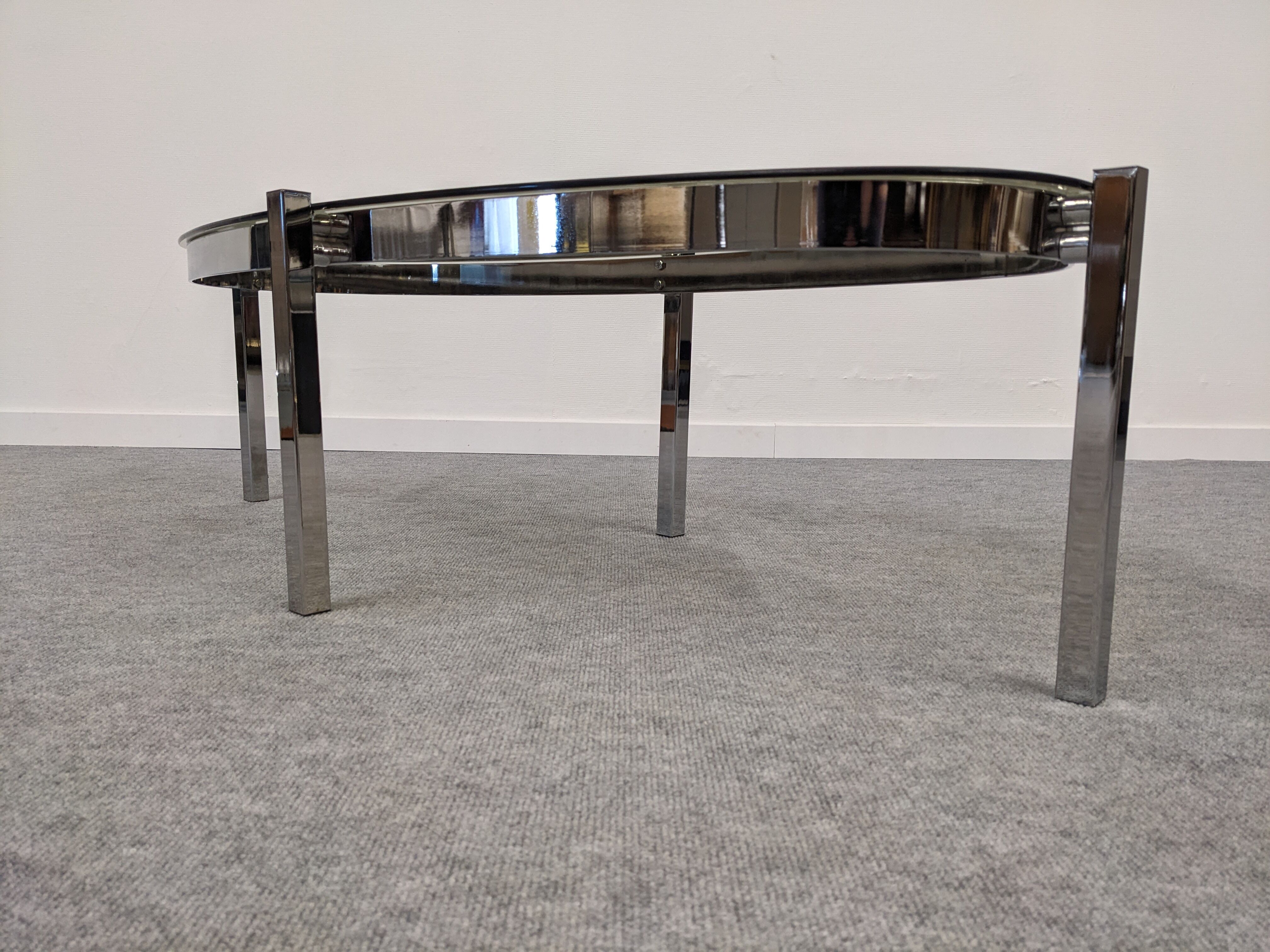 Oval smoked glass coffee table from the 60s/70s