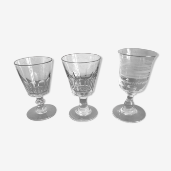 Set of 3 old glasses on foot