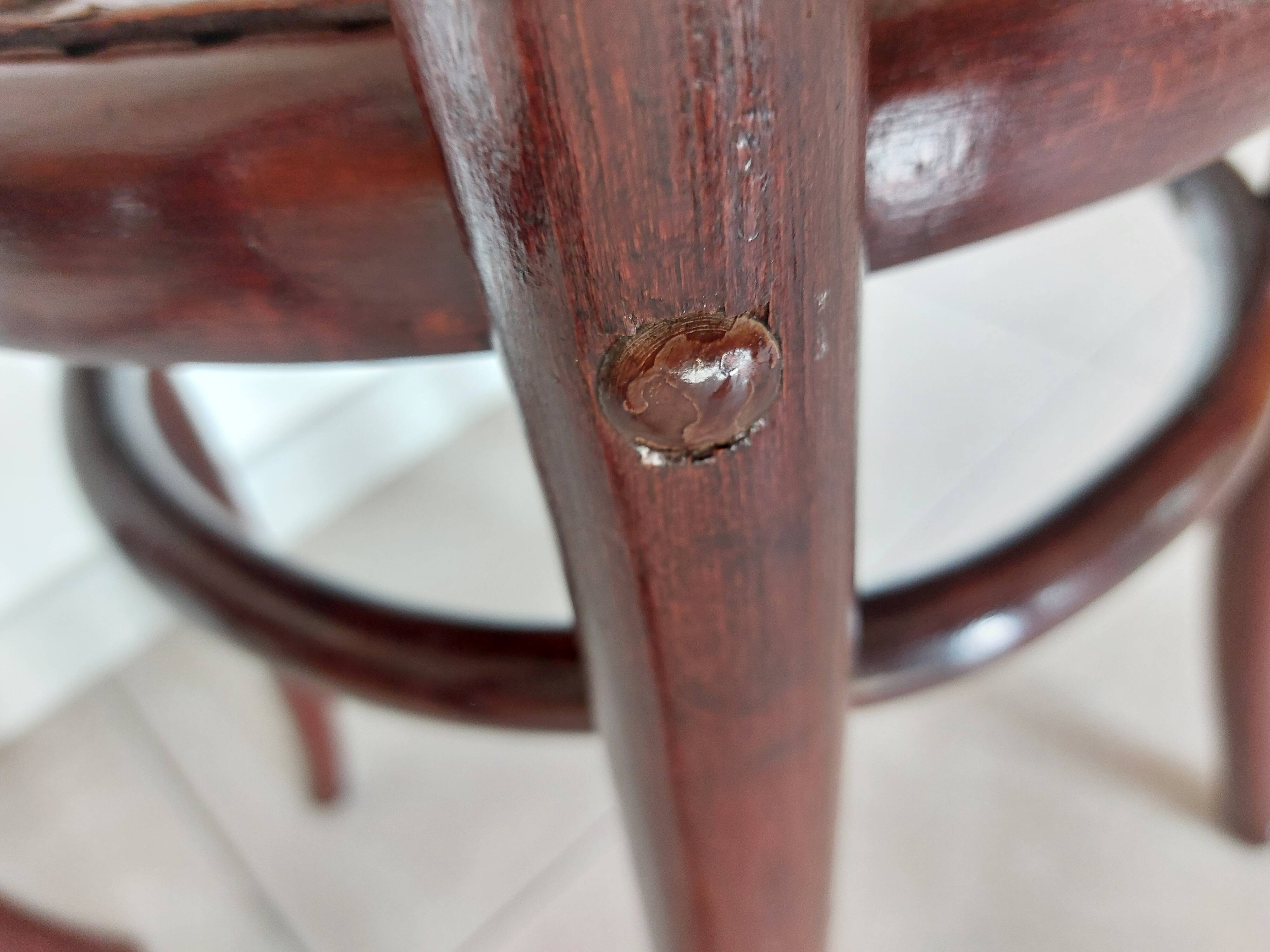 pair of round bistro chairs with a pattern on the seat, vintage