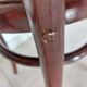 pair of round bistro chairs with a pattern on the seat, vintage