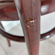 pair of round bistro chairs with a pattern on the seat, vintage