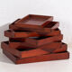 Plateaux japonais anciens empilables en bois teinté – période Taishō–Showa (c.1910–1940)
