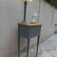 Bedside table, coffee table enhanced in smoky green, wooden top.
