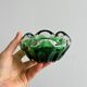 Translucent green ashtray.