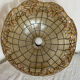 Large mother-of-pearl and brass chandelier with floral decoration.