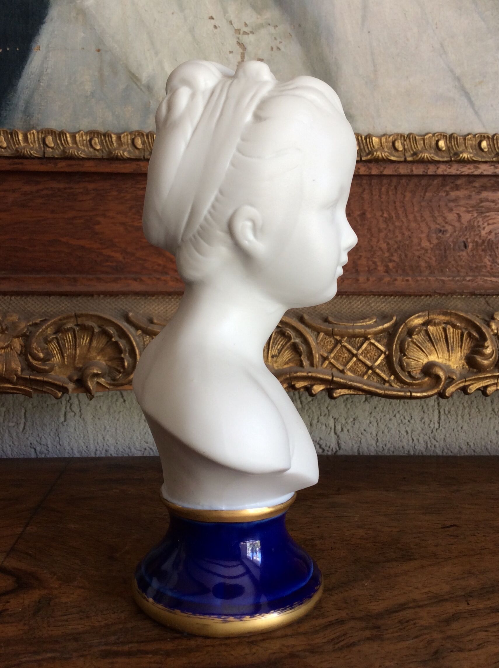 Small biscuit bust with blue base