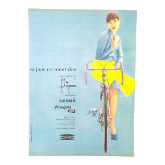 Paper advertisement dress tergal woman bicycle bicycle from a magazine of time