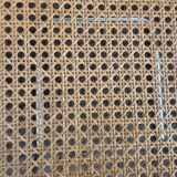 Wooden chair with caning in the style of Marcel Breuer.