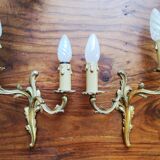 Pair of appliques with two arms of light with a leafy decoration