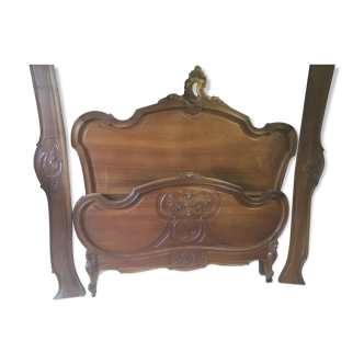 Louis XV style bed in carved walnut