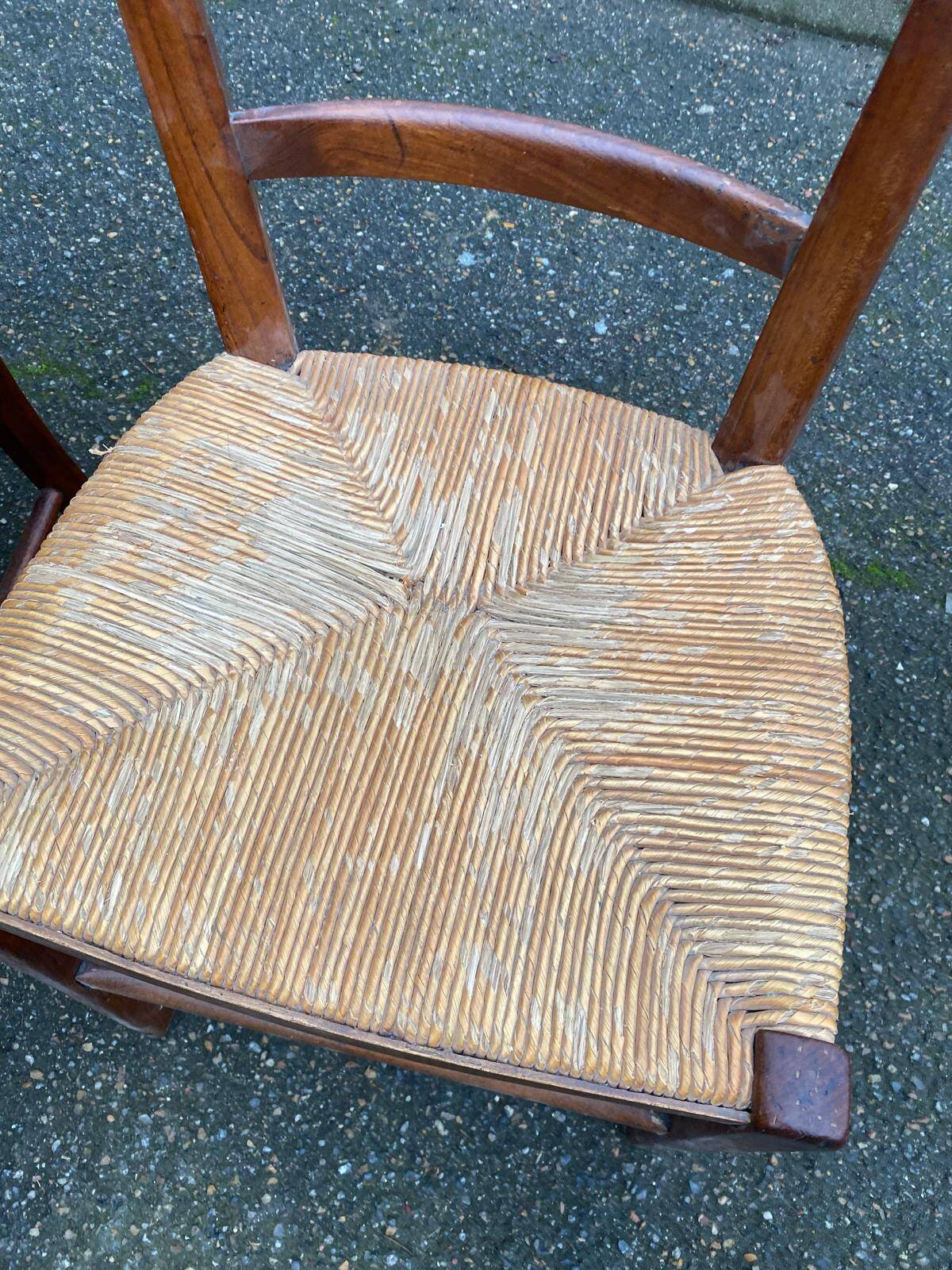 2 solid wood chairs with rush seats, child size.