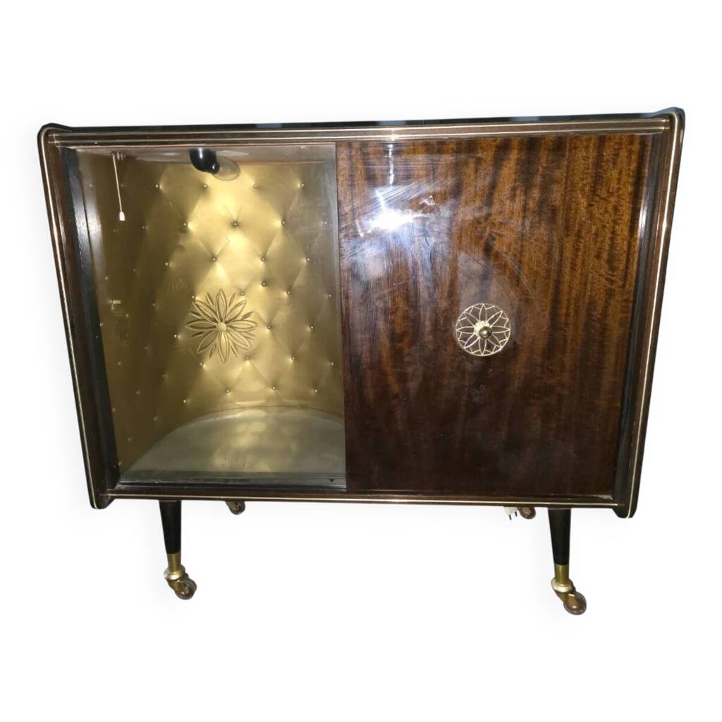 Vintage 50s-60s bar cabinet with tufted upholstery and lighting.