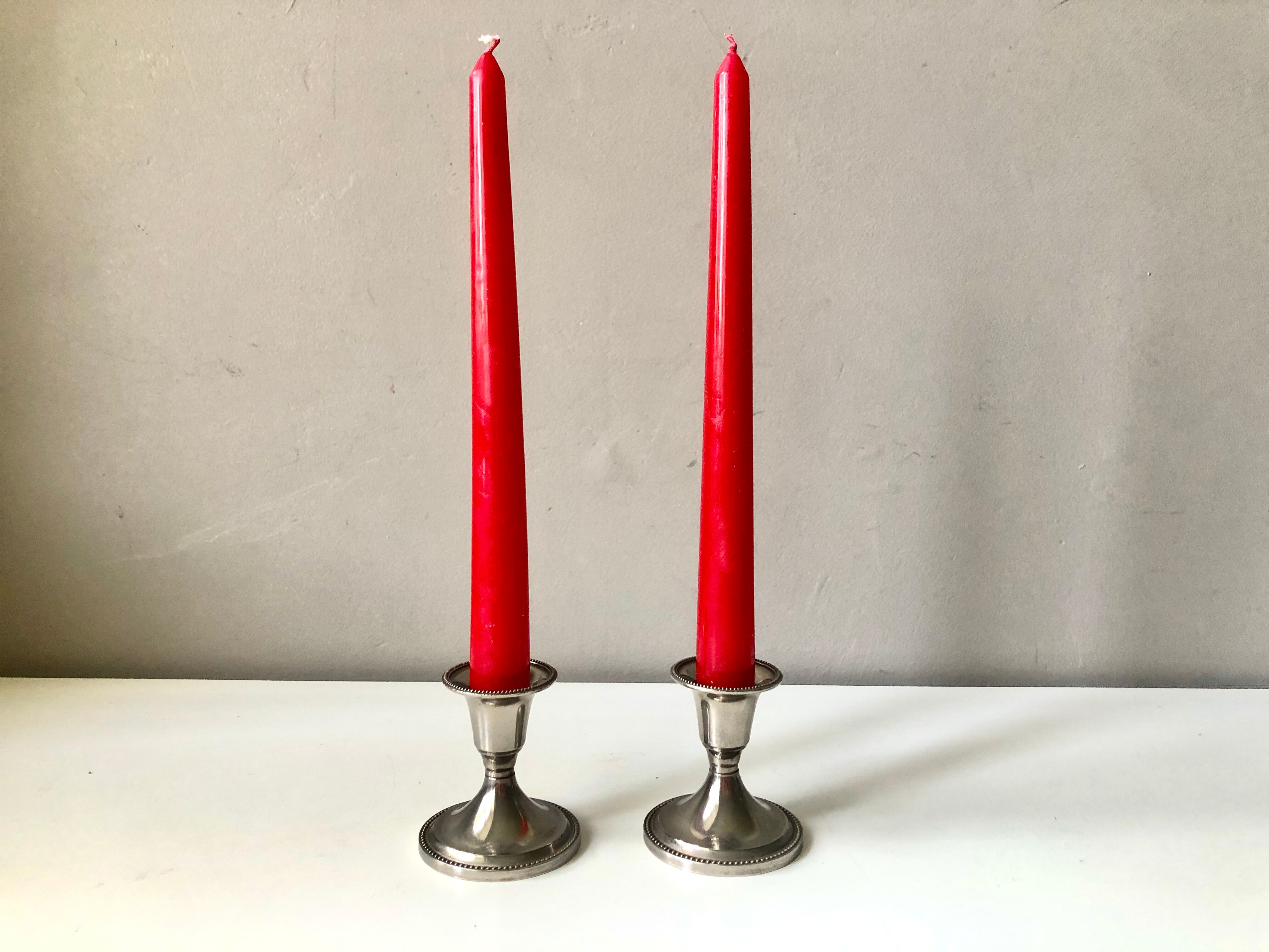 Pair of silver metal candle holders