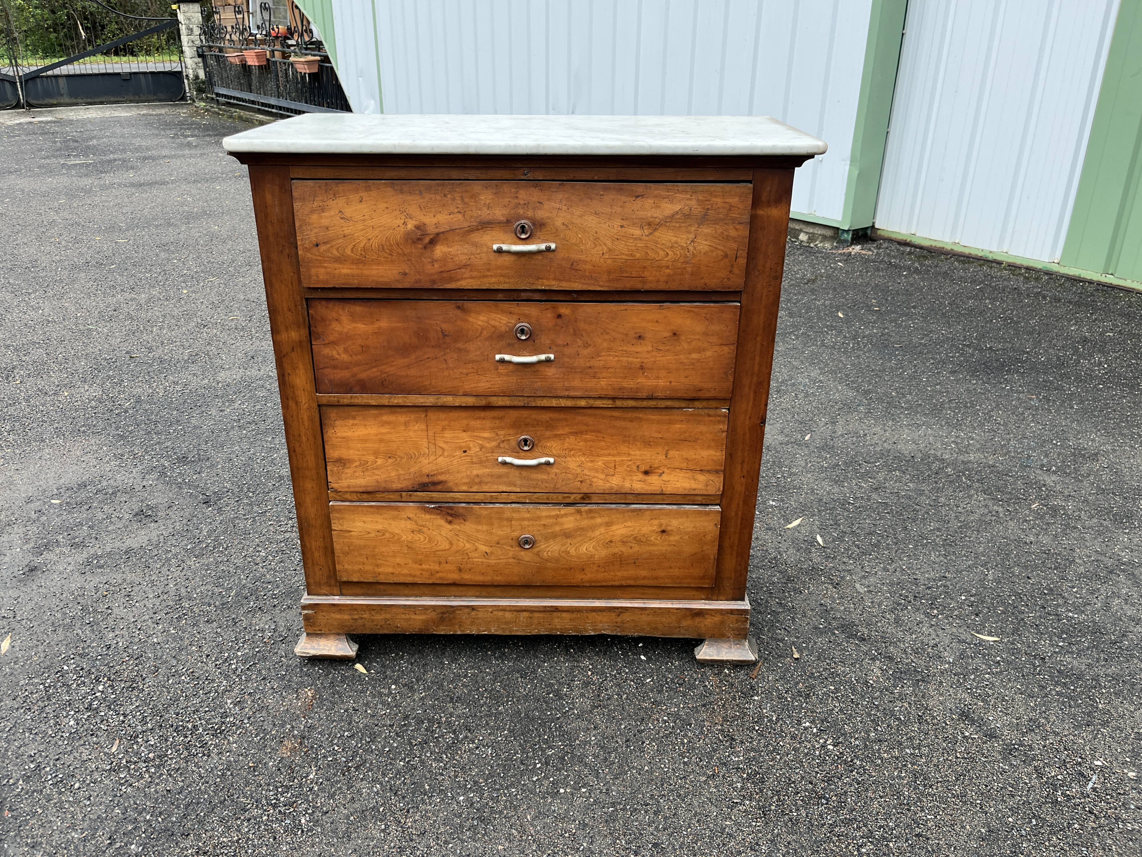 Antique 19th-century wooden chest of drawers with a marble top