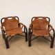 Pair of Tito Agnoli armchairs in leather and bamboo, 1970s.