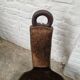 Antique tripod chair in solid wood and animal skin.