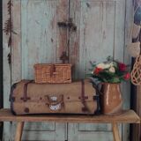 Old suitcase in canvas, wood and metal