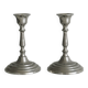 Pair of small metal candle holders, classic design.