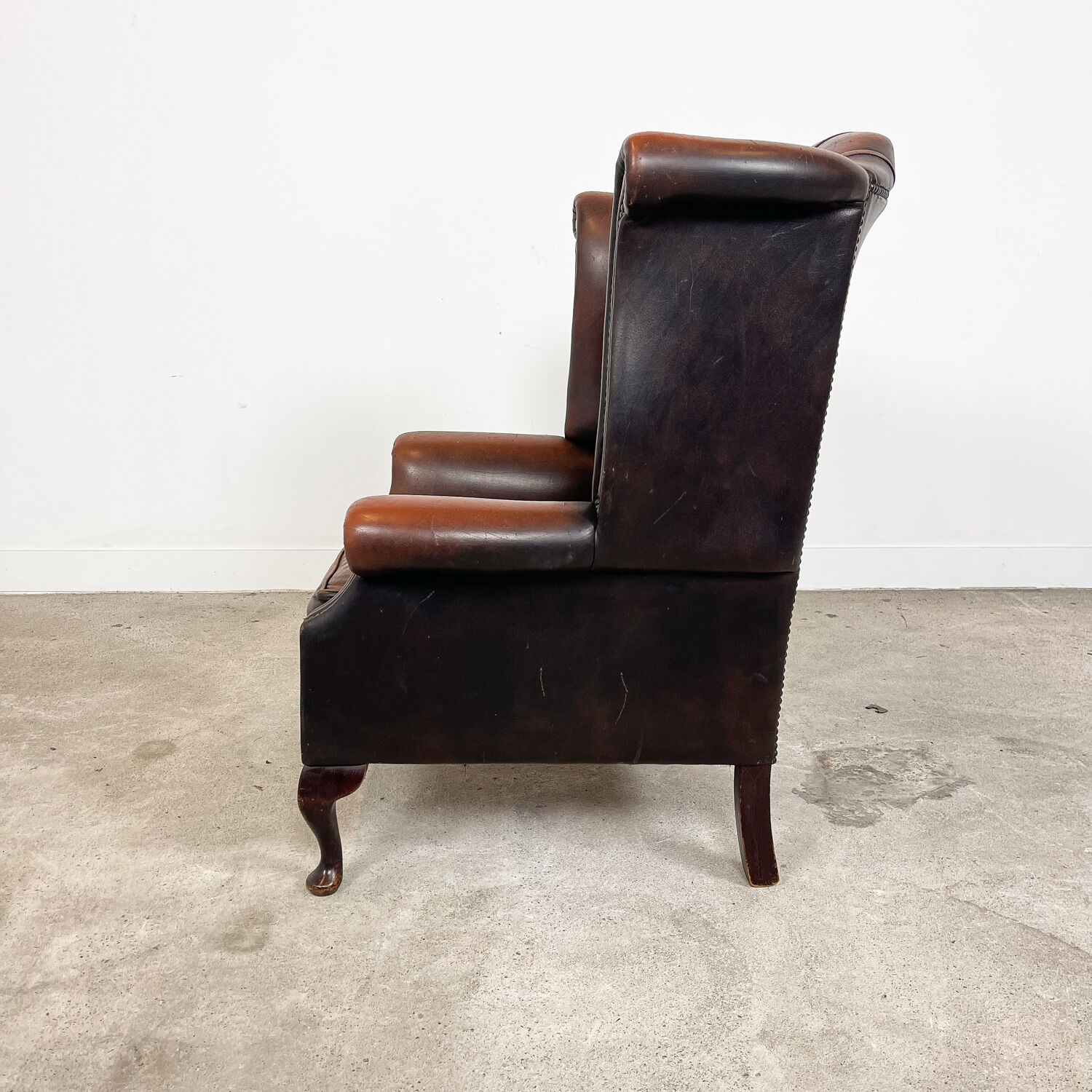 Vintage rustic dark brown leather chesterfield wingback armchair wassenaar
