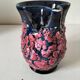 Vintage pitcher in midnight blue glazed ceramic with bright pink relief