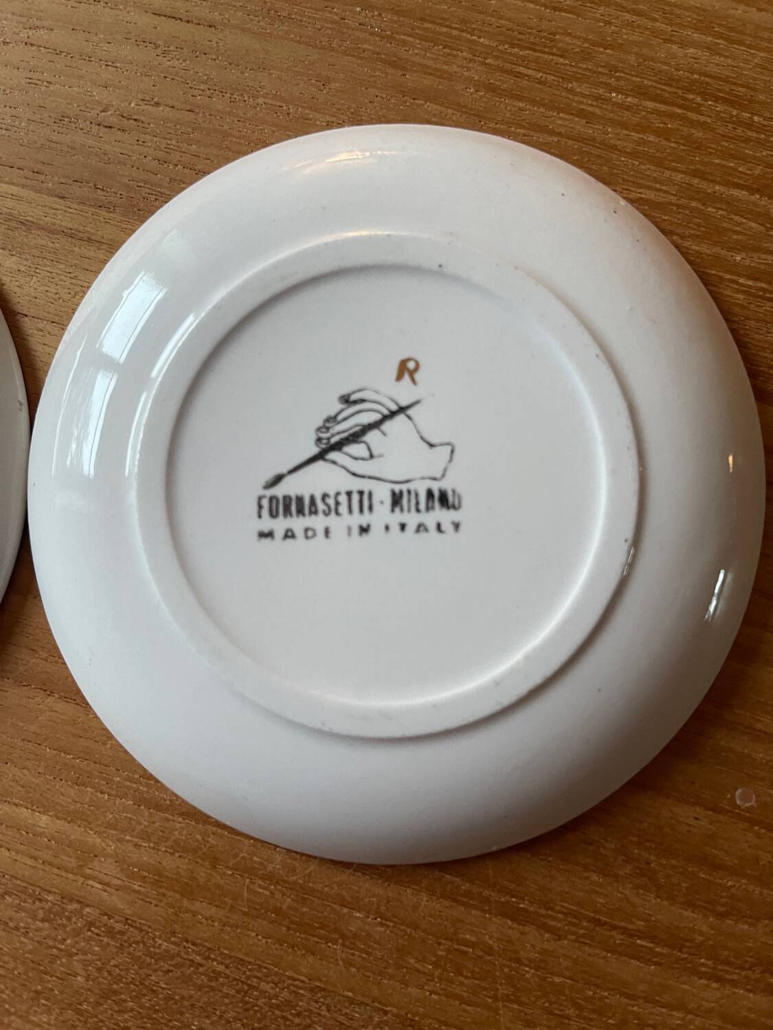 Small Fornasetti plates
