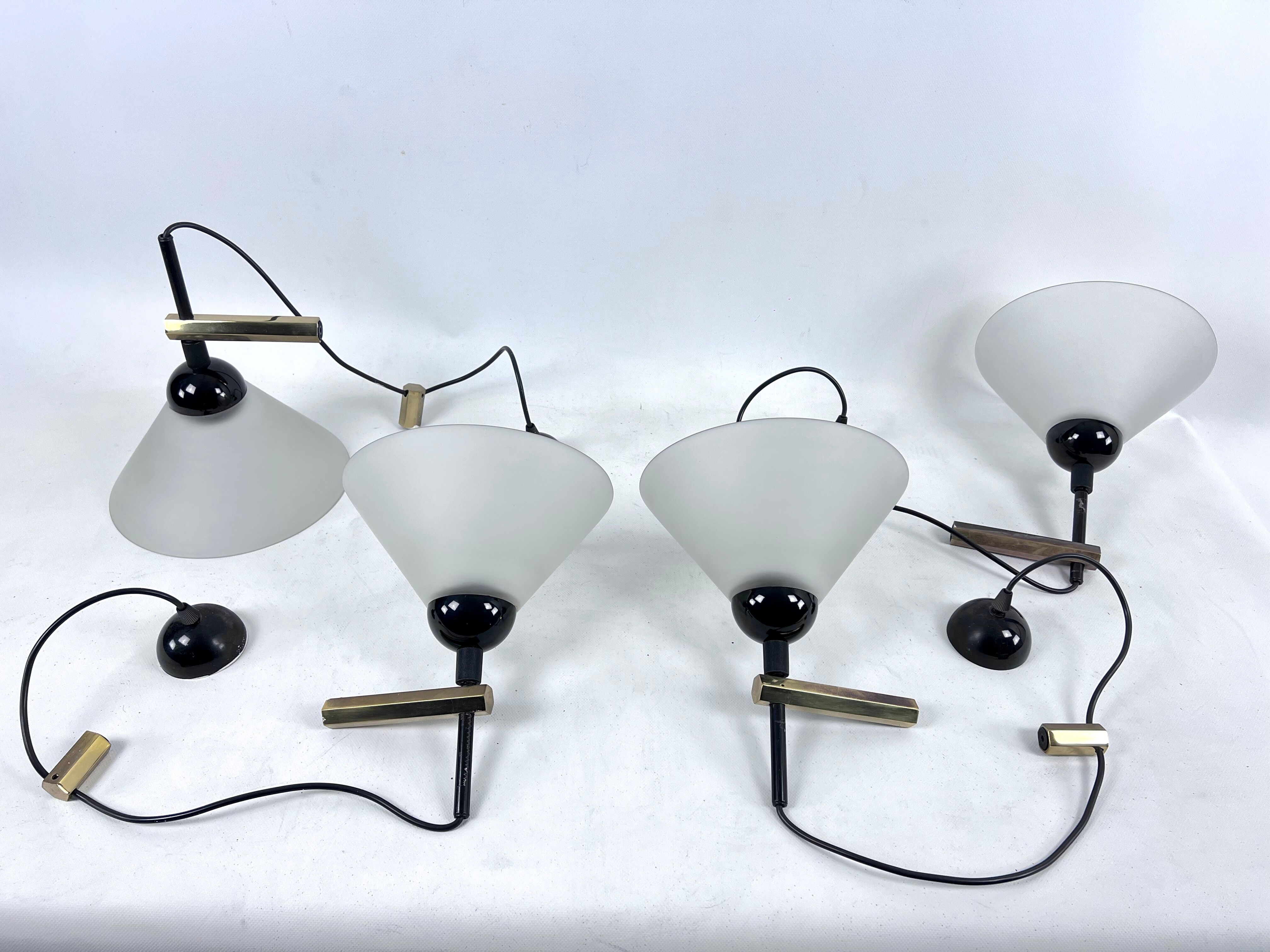 Rare Set of four Italian Modern brass and Murano glass wall lamps by Quattrifolio. 1970s