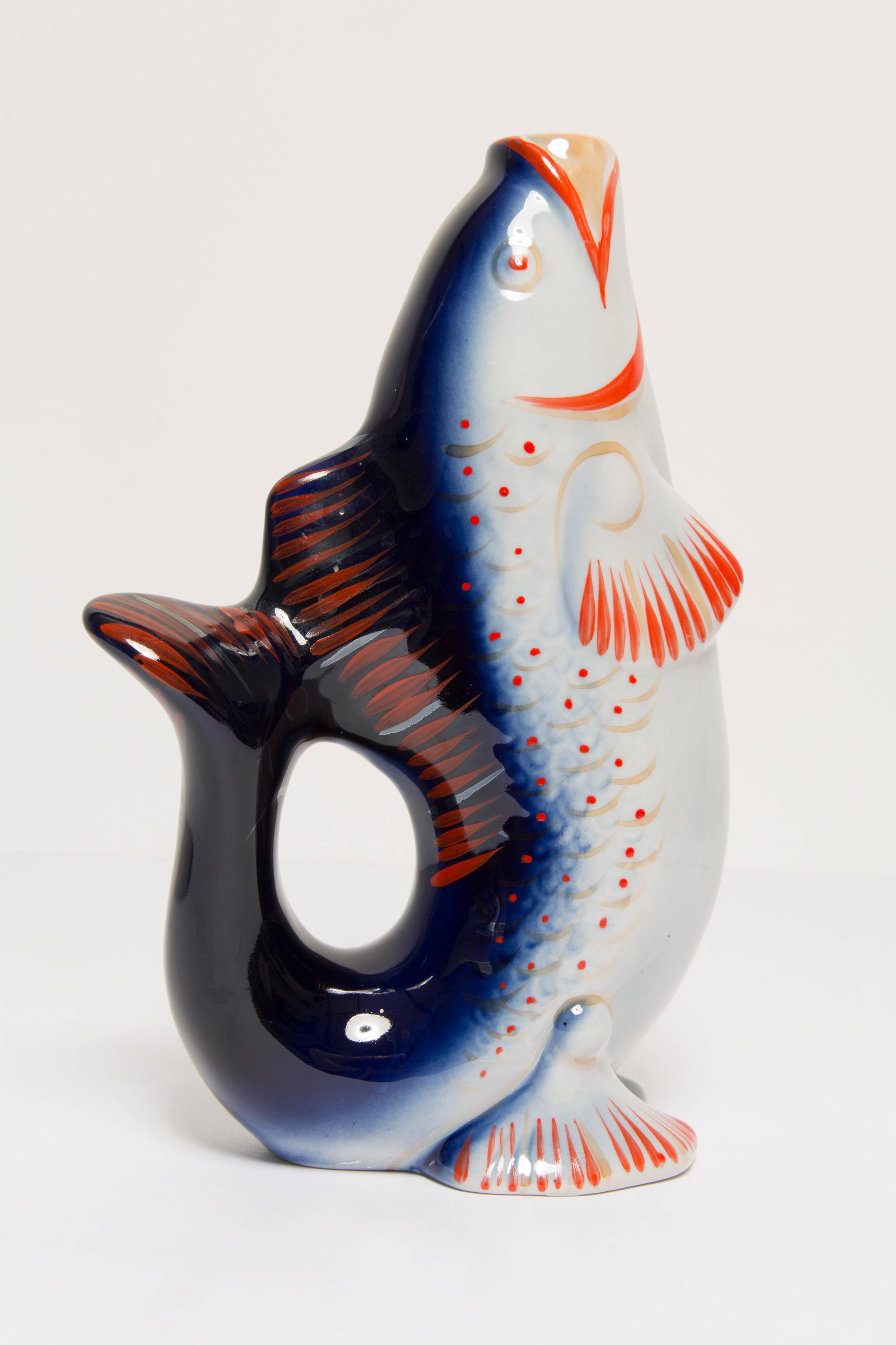 Set of 7 blue glass fish, mid-20th century.