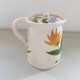 Old earthenware pitcher with its lid