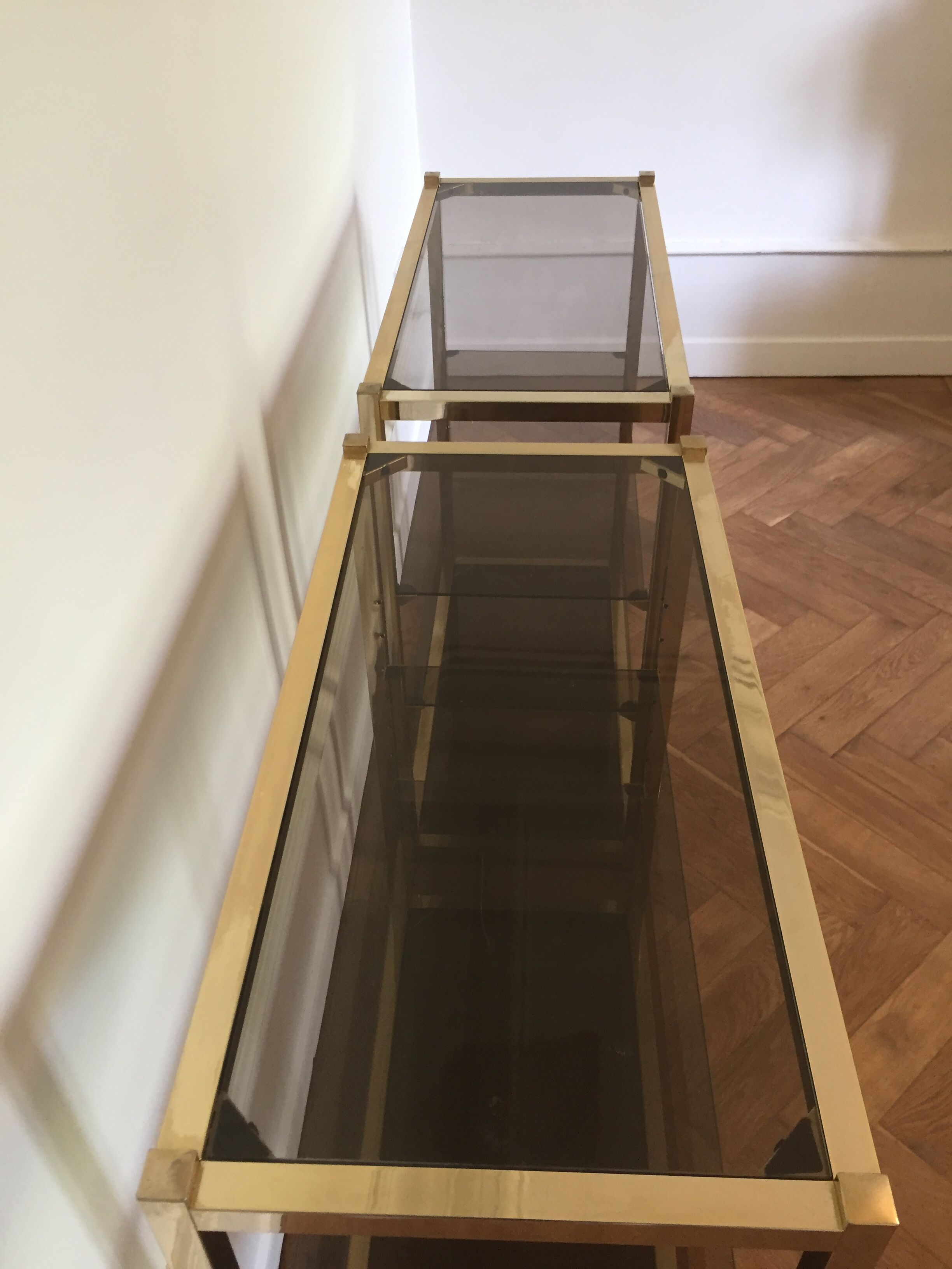 Pair of consoles brass shelves and smoked glass design Roche Bobois