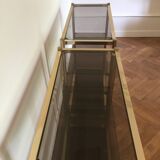 Pair of consoles brass shelves and smoked glass design Roche Bobois