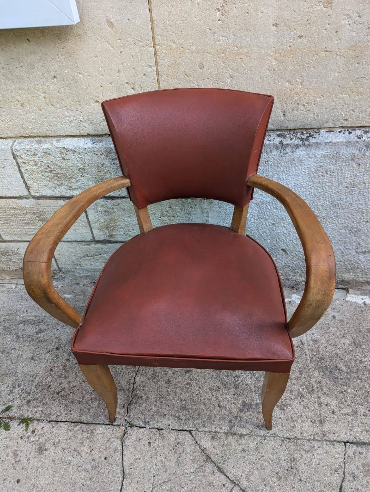 Vintage style armchair from the 50s, wood and faux leather