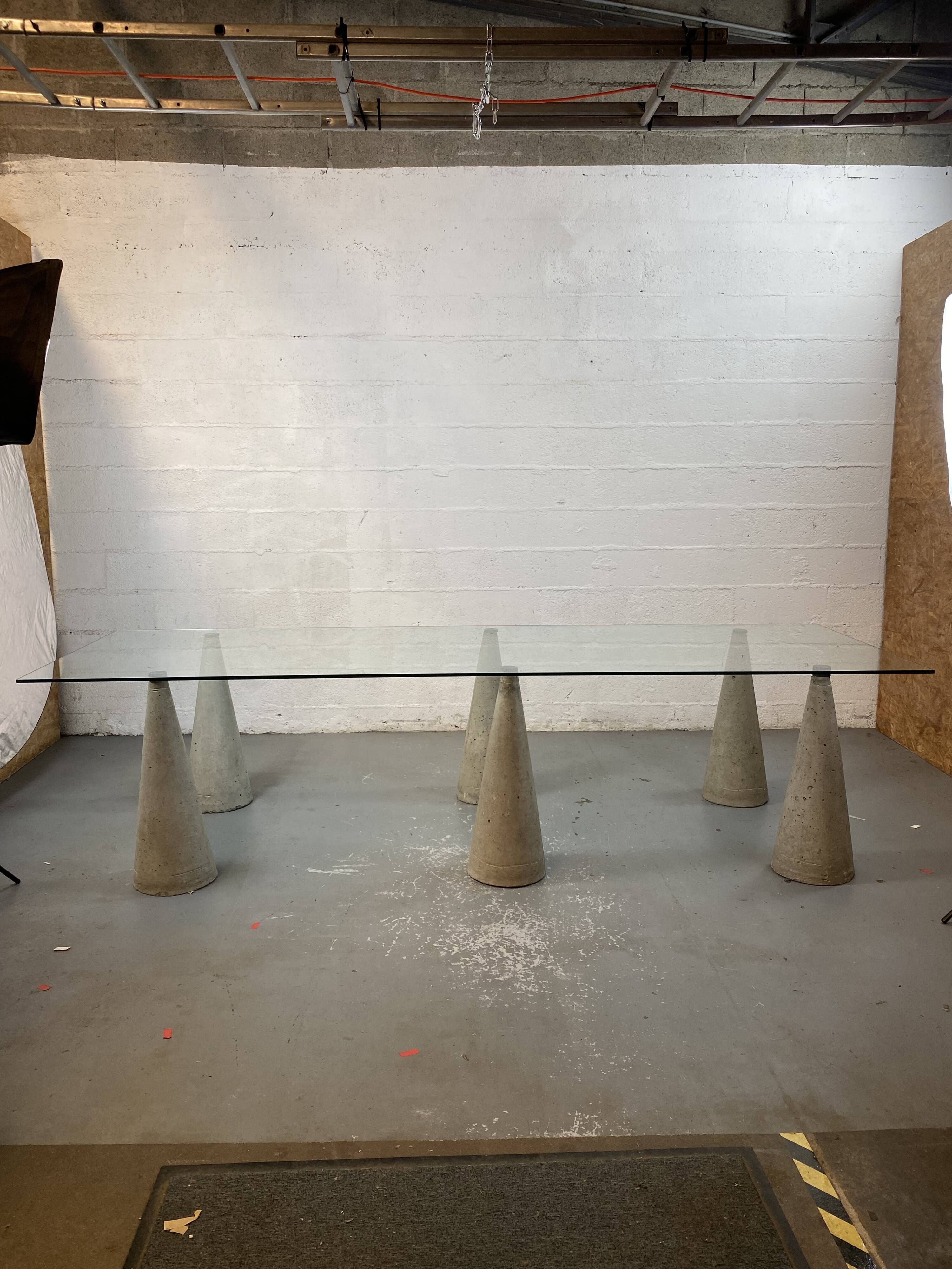 Glass table with cement legs