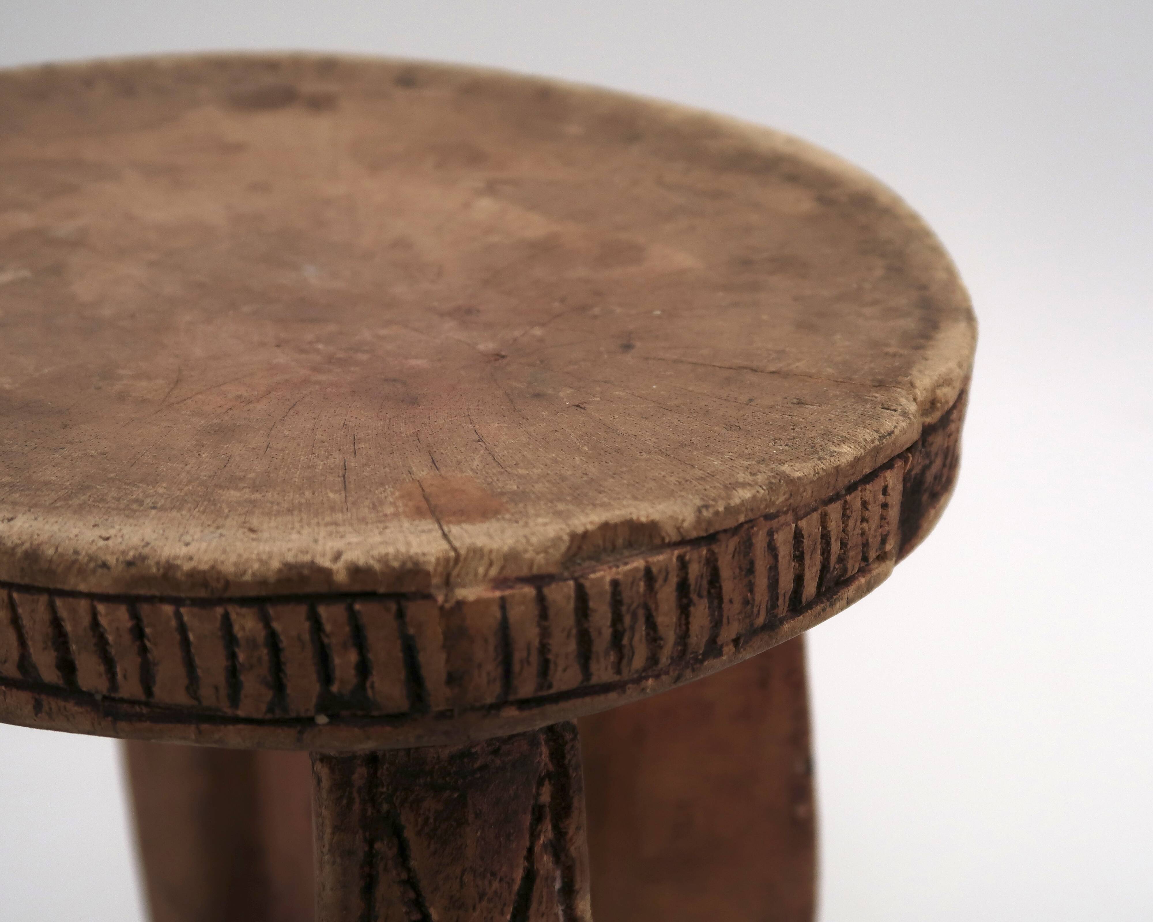 African stool with scarified wooden decoration, 1980s