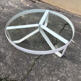 Round coffee table with a metal/leather frame and glass top by Roche Bobois.