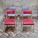 Pair of red leatherette chairs