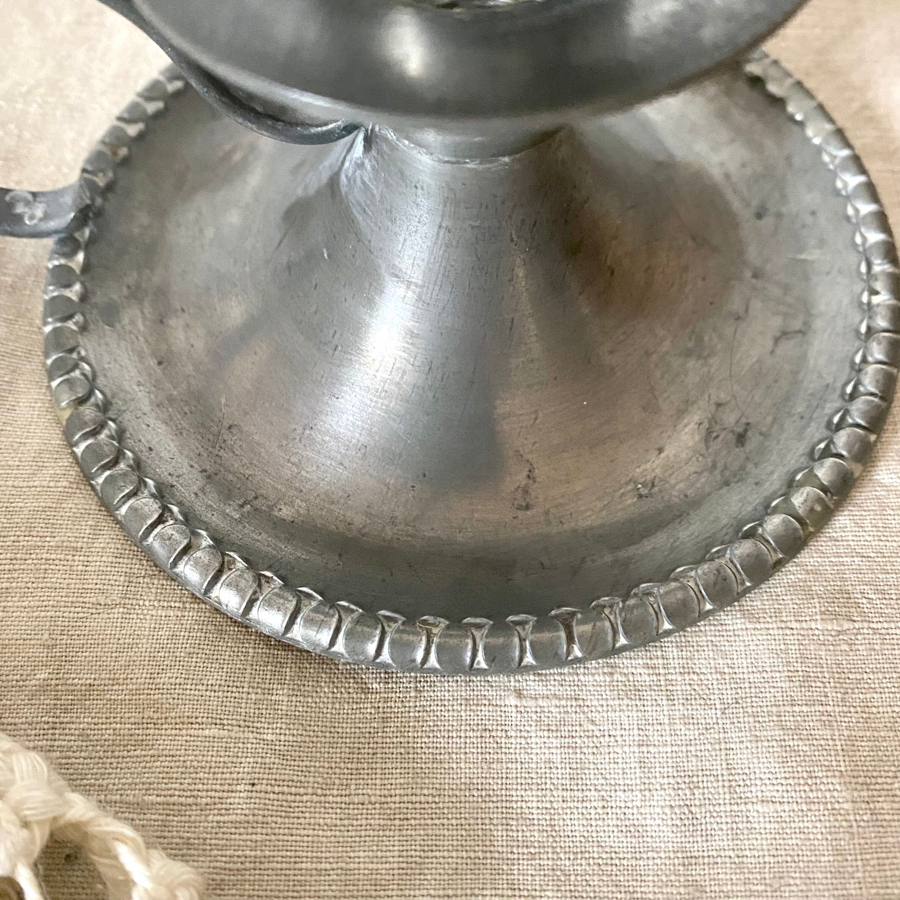 Tin thumb candle holder