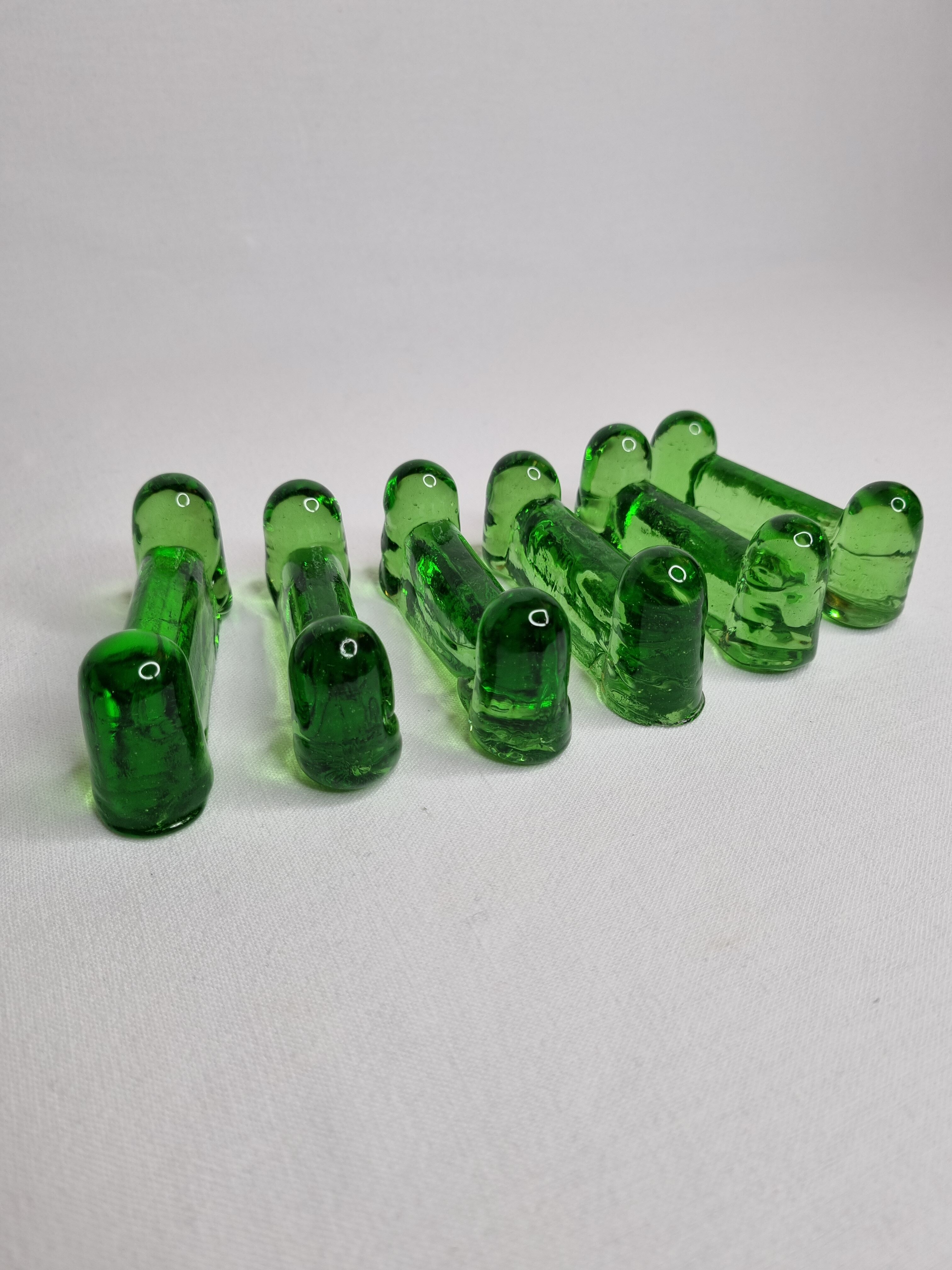 Set of six emerald glass knife holders signed Biot