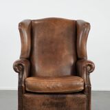 Warm, cosy and comfortable vintage sheepskin ear armchair with character