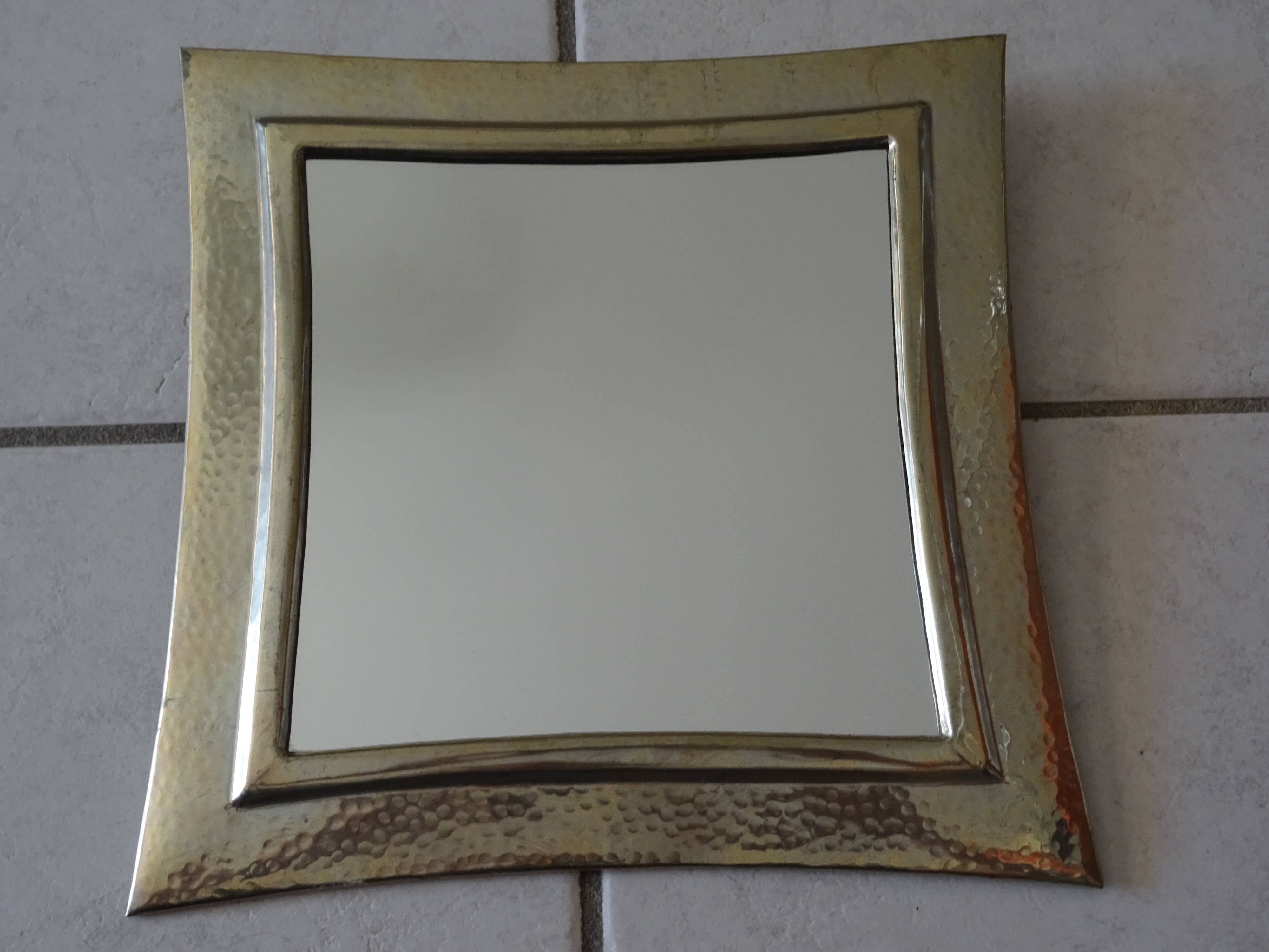 Hammered metal mirror design