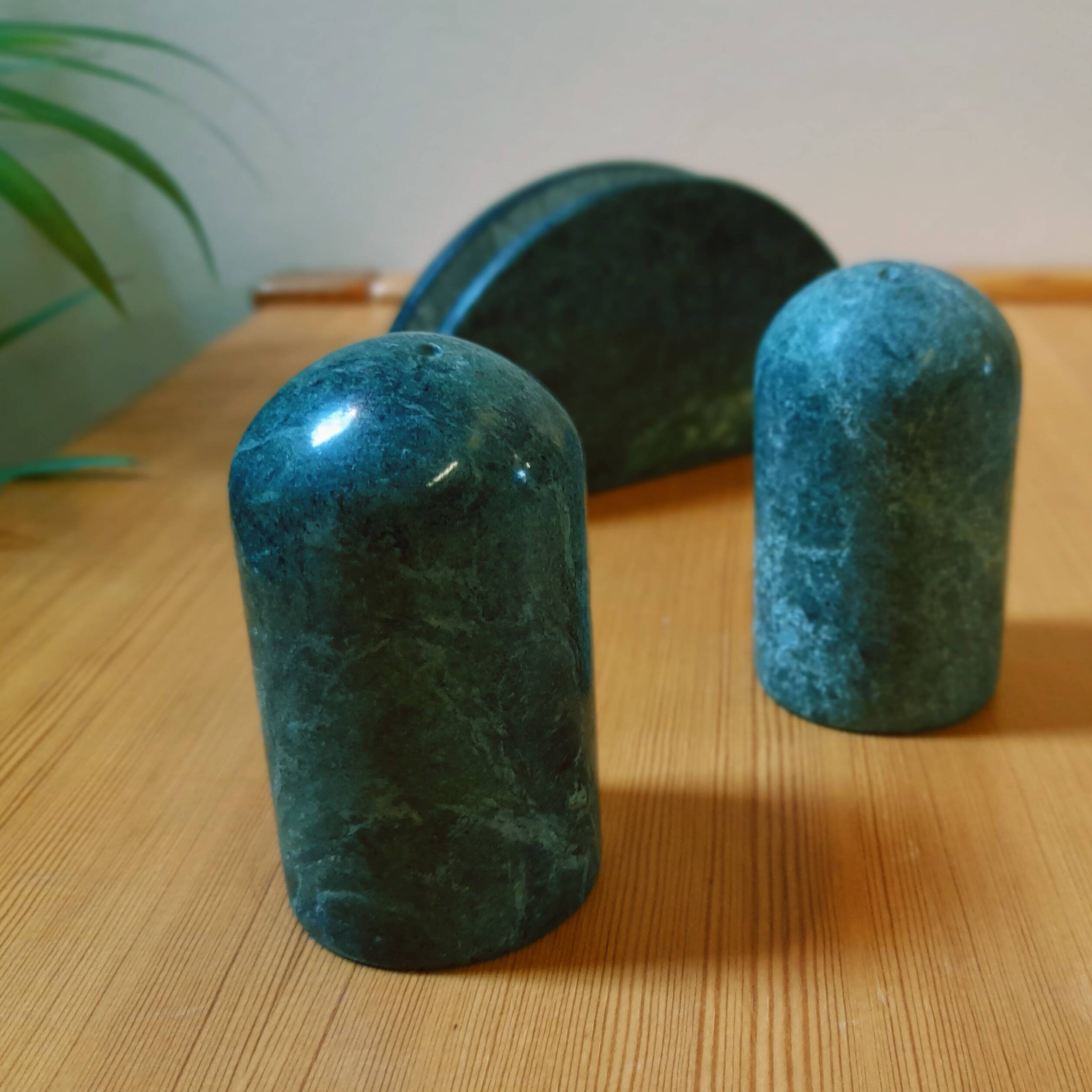 Trio of salt shakers, pepper shakers and napkin holders in green marble