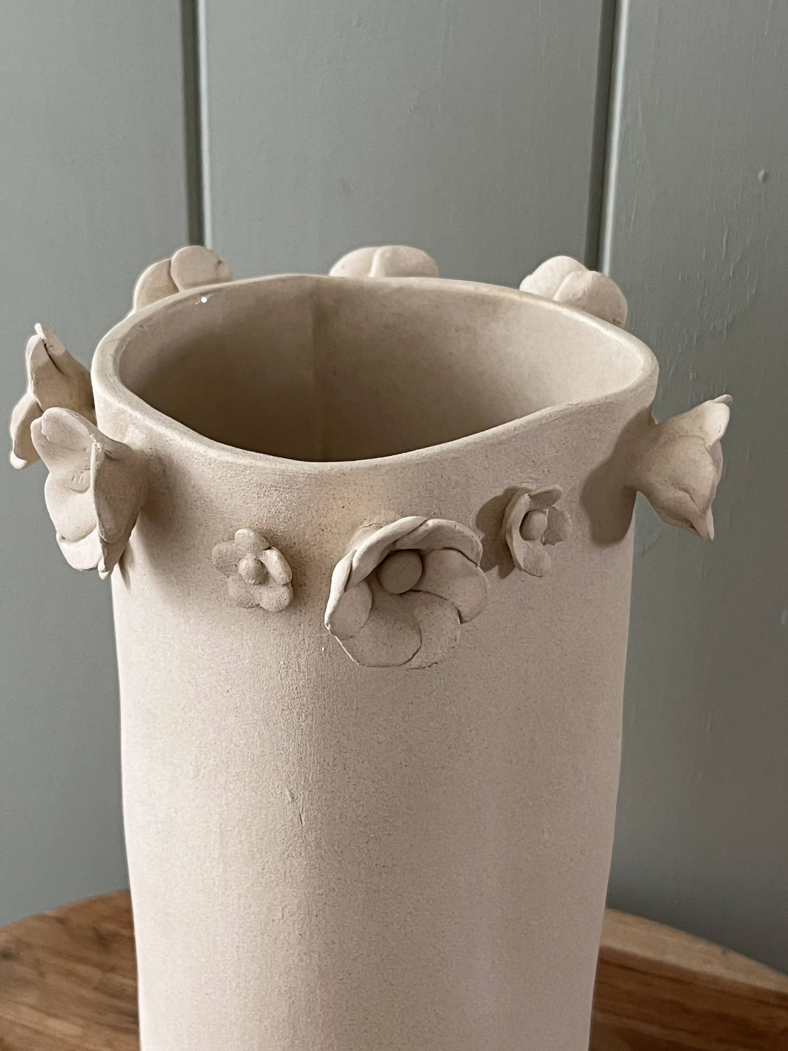 Stoneware vase with relief flowers