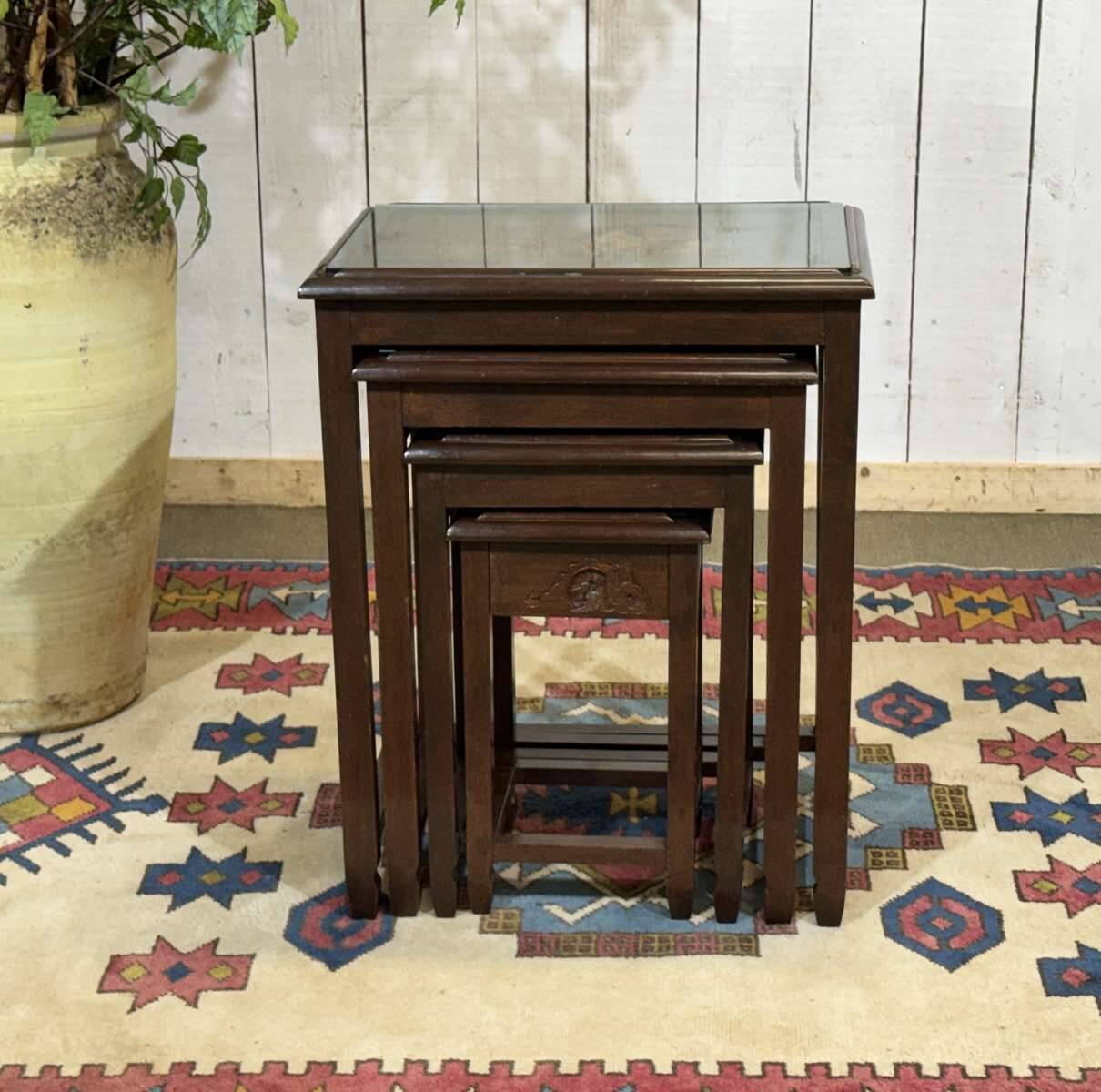 Set of 4 Chinese nesting tables in teak from the 1980s.