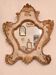 Eighteenth-century Venetian mirror in painted and gilded wood.
