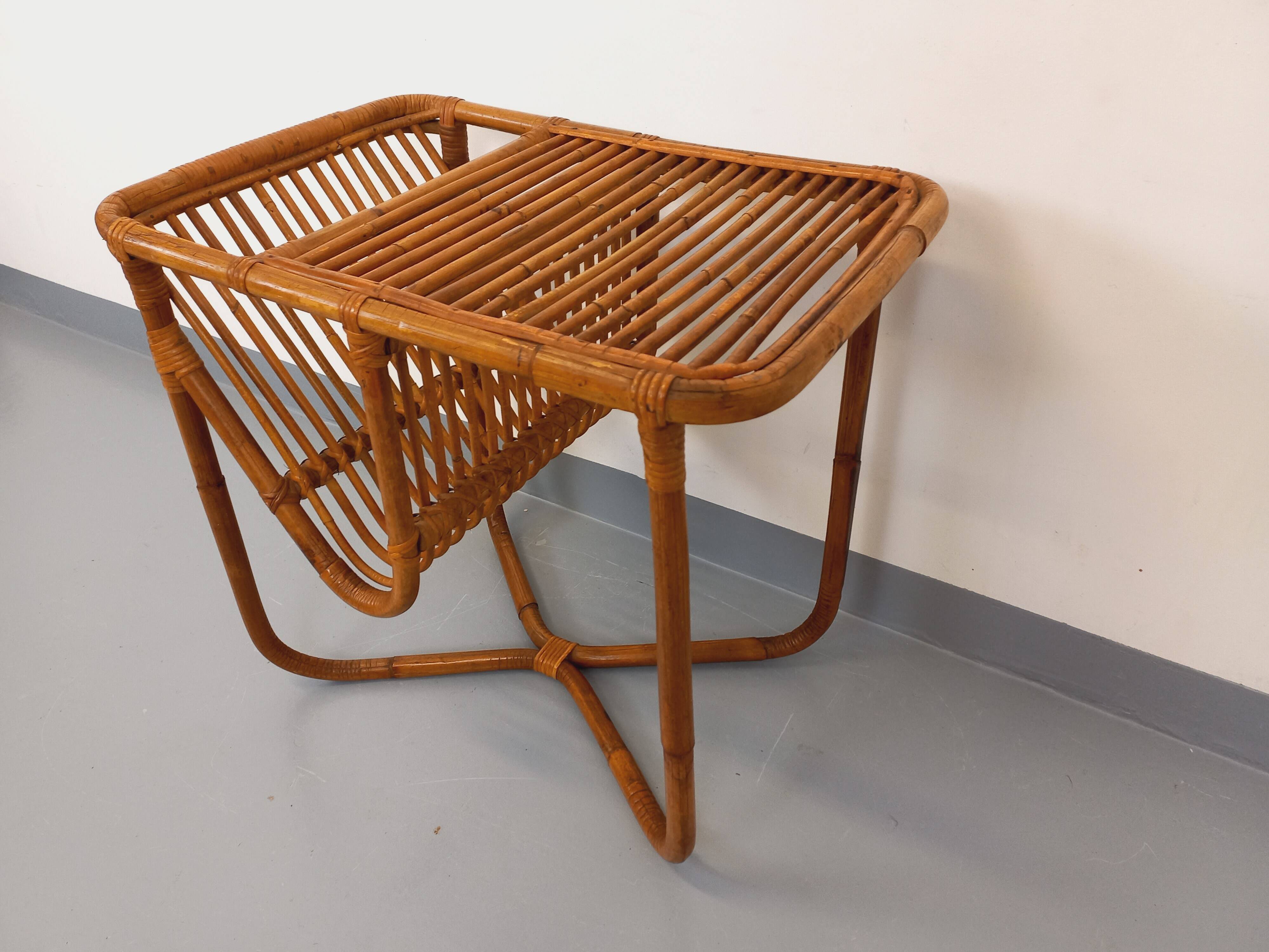 Side table / coffee table with vintage 1960s rattan magazine rack.