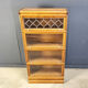 Four tier oak barrister style bookcase with leaded glass